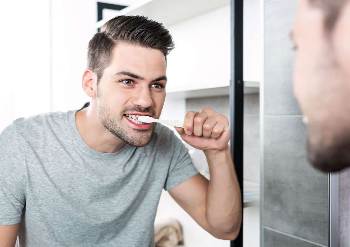 A man brushing his teeth
