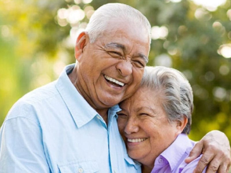 A senior couple smiling