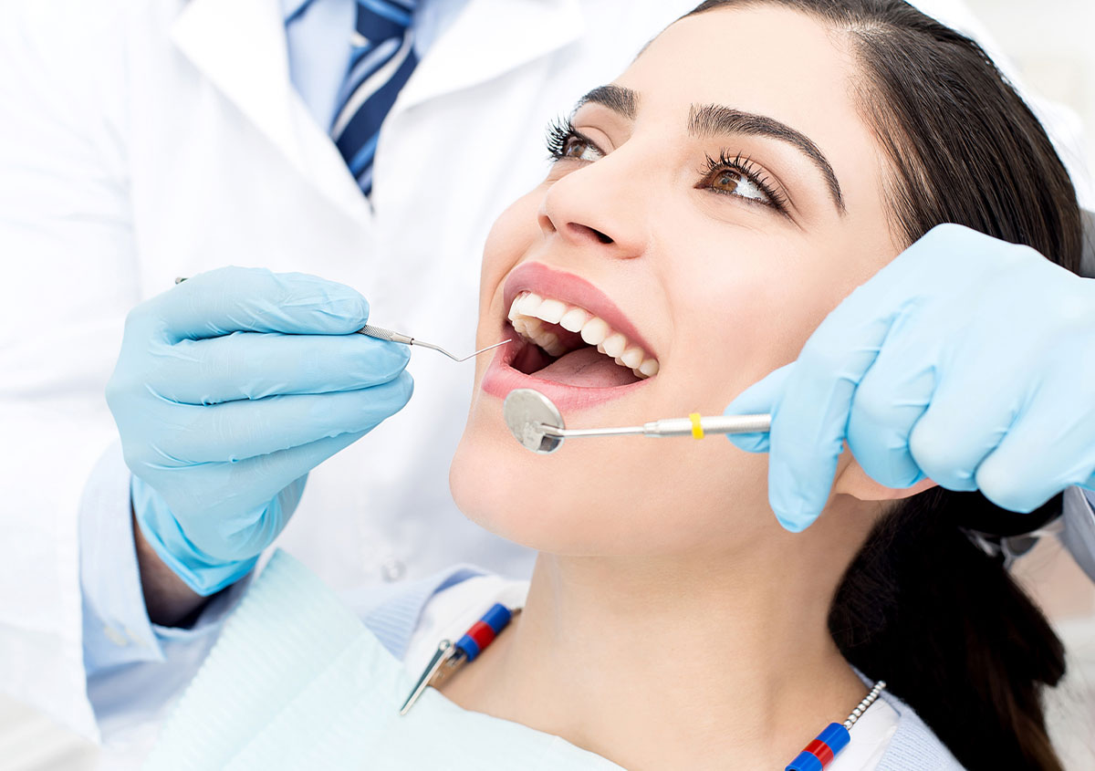 A woman is having dental checkup