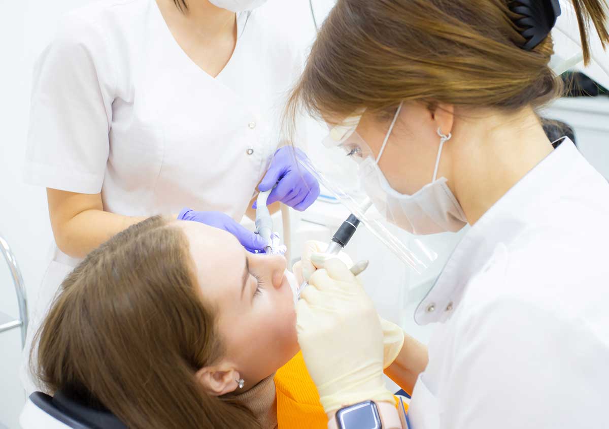 Female patient getting dental treatment